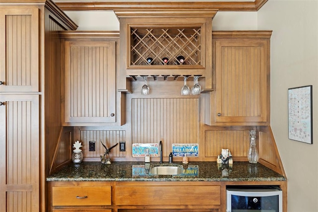 bar with a dry bar, beverage cooler, and a sink