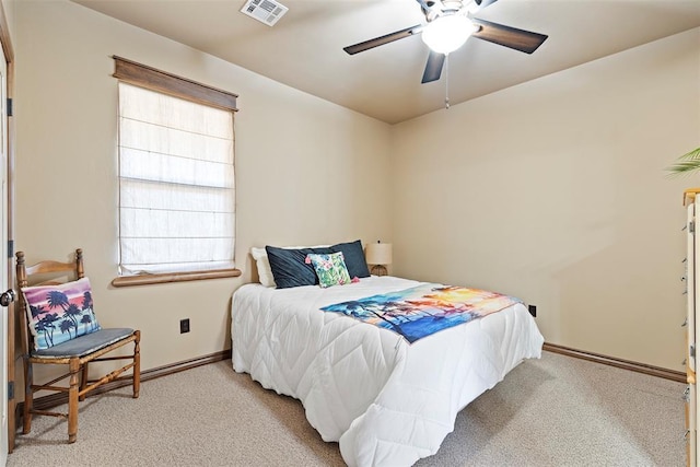 bedroom with carpet, visible vents, and baseboards