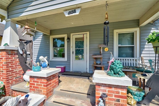 doorway to property featuring a porch