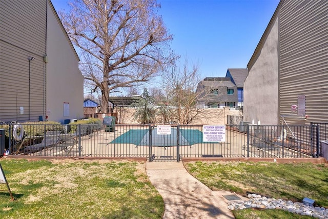 community pool featuring a patio and fence