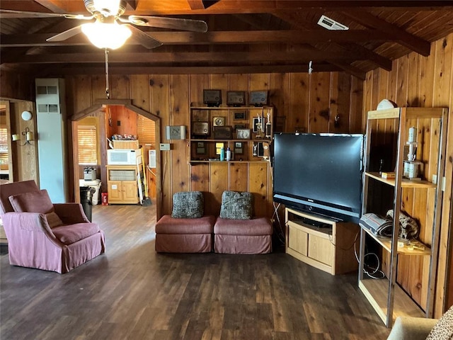 22 W Shore Dr, Arcadia, OK 73007 - living area featuring ceiling fan, lofted ceiling with beams, wooden walls, visible vents, and dark wood-style floors