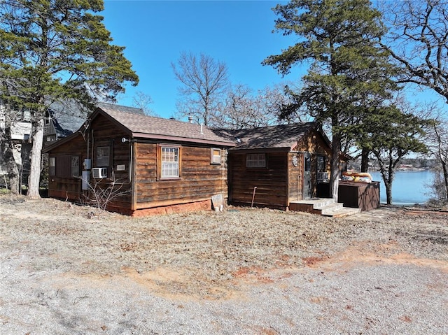 view of front of house featuring cooling unit