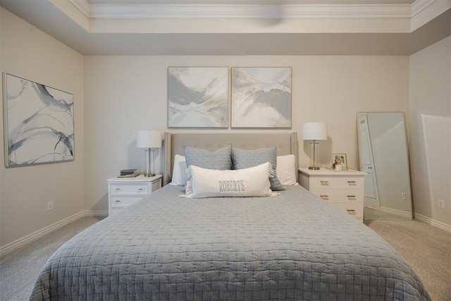 bedroom with baseboards, a raised ceiling, light colored carpet, and crown molding