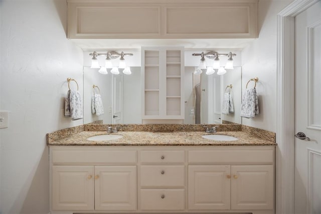 full bathroom featuring double vanity and a sink