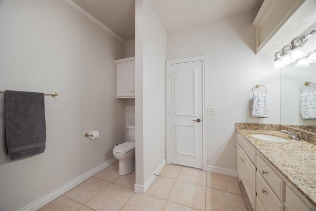 bathroom featuring tile patterned flooring, baseboards, toilet, ornamental molding, and vanity