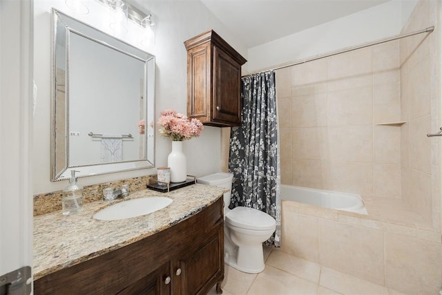 full bath with tile patterned floors, toilet, vanity, and tiled shower / bath