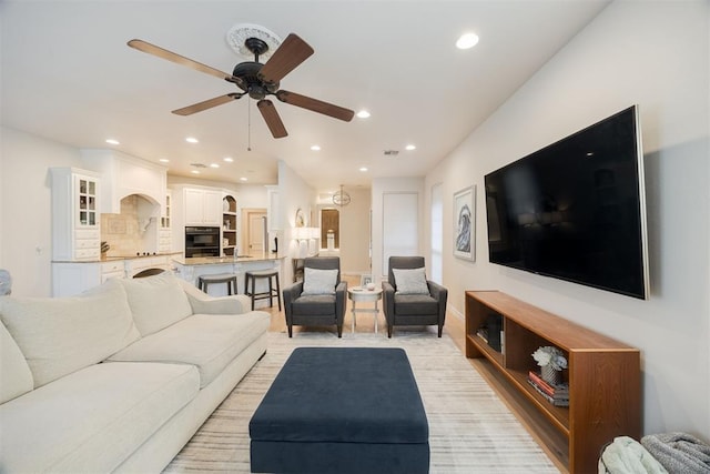 living room featuring recessed lighting and ceiling fan