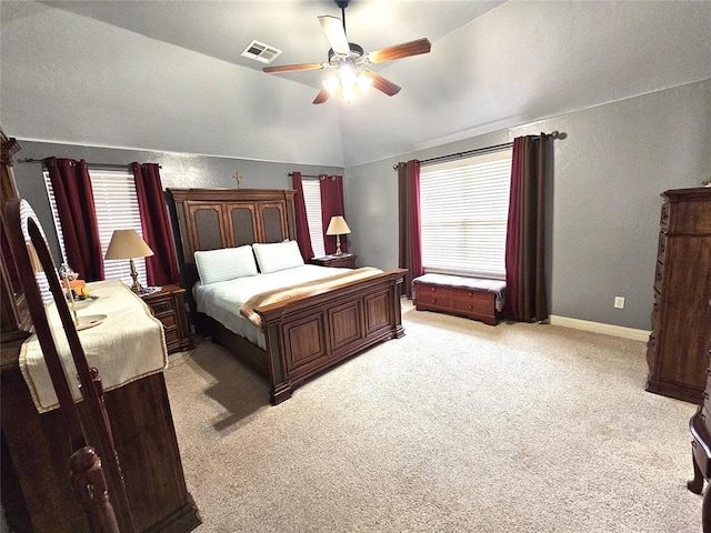 bedroom featuring light carpet, baseboards, visible vents, lofted ceiling, and ceiling fan