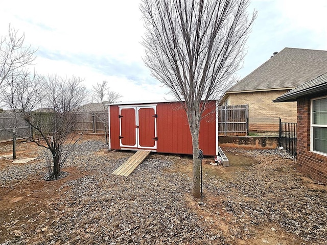 view of shed with a fenced backyard