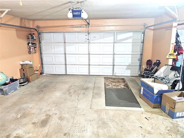 garage featuring a garage door opener