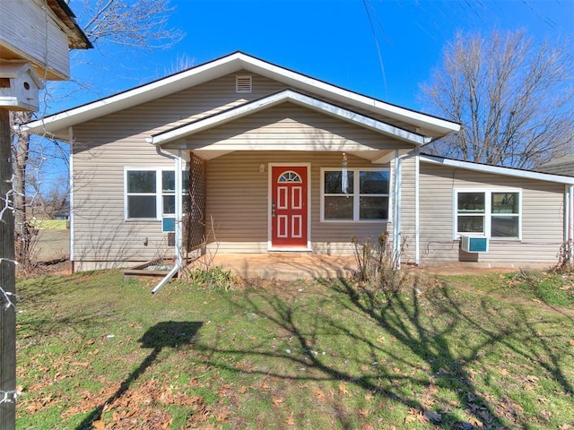 view of front facade with a porch and a front yard