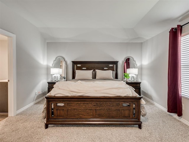 carpeted bedroom with baseboards