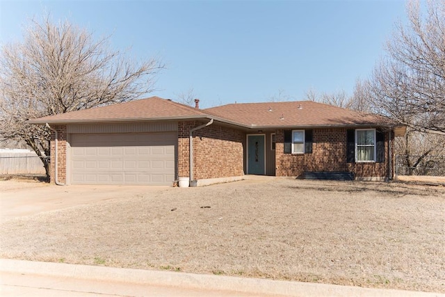 single story home featuring a garage, fence, concrete driveway, and brick siding