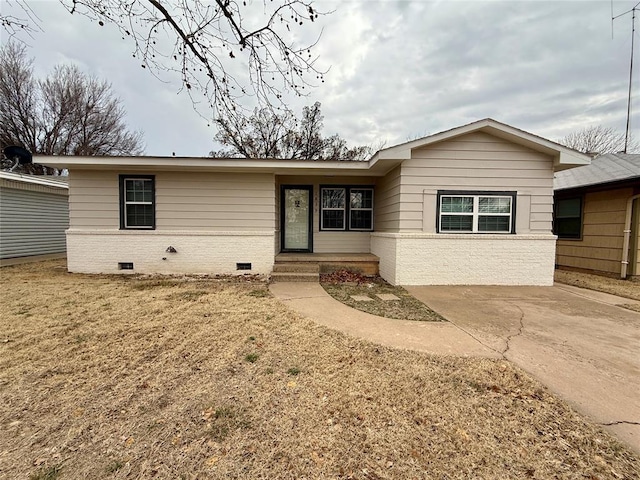 ranch-style house featuring crawl space and brick siding