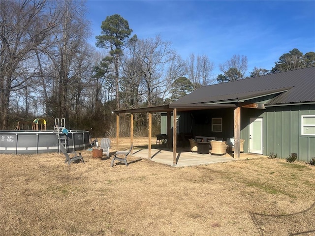 exterior space featuring an outdoor hangout area, an outdoor pool, and a patio