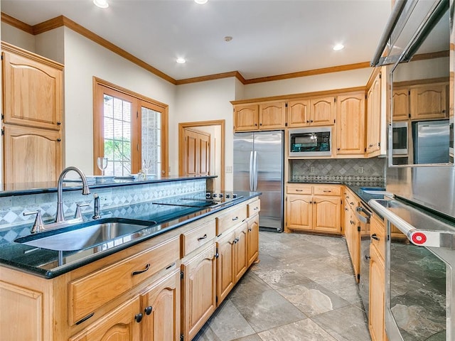 kitchen featuring stainless steel appliances, a sink, ornamental molding, backsplash, and light brown cabinetry