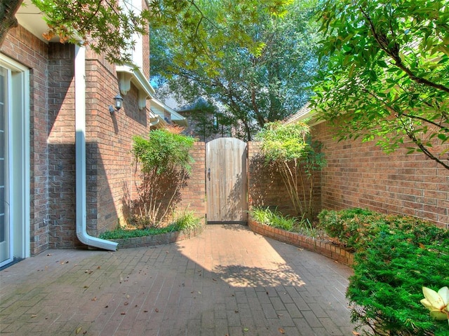 view of patio / terrace featuring a gate