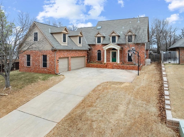 view of front of home featuring a garage, concrete driveway, roof with shingles, fence, and brick siding