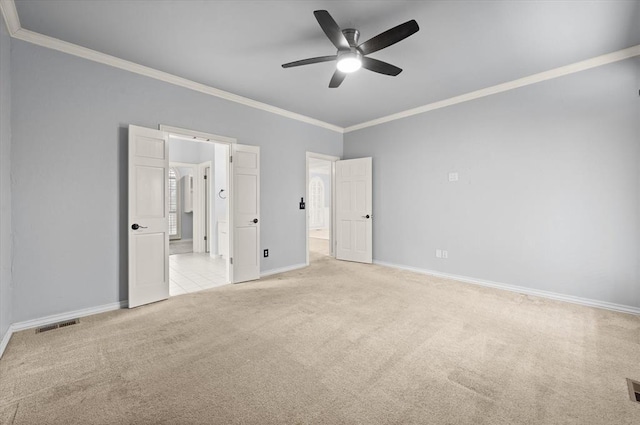 unfurnished bedroom featuring visible vents, ornamental molding, a ceiling fan, light carpet, and baseboards