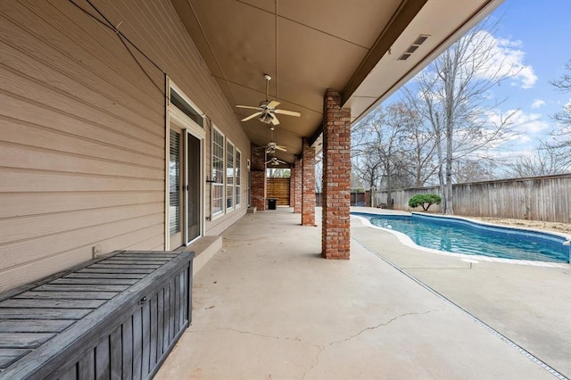 view of pool featuring ceiling fan, a patio, a fenced backyard, and a fenced in pool