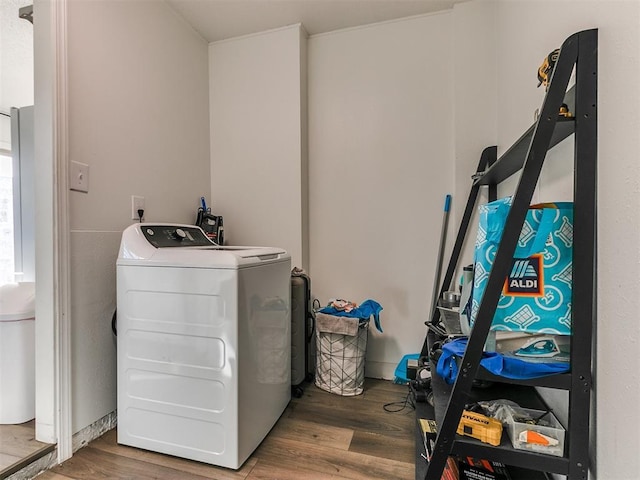 laundry area with laundry area, wood finished floors, and washer and dryer