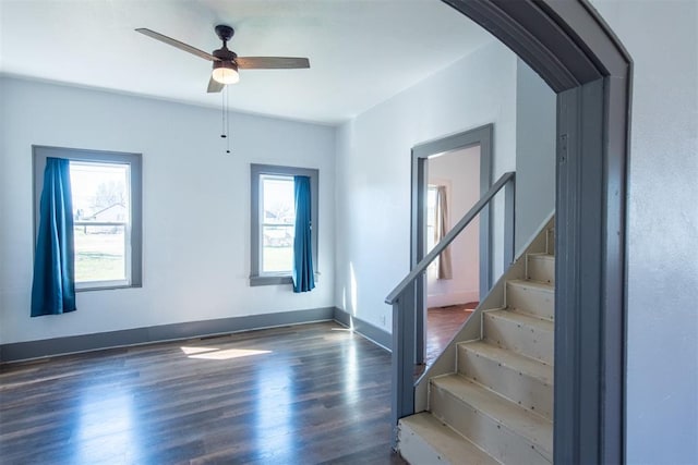 709 S Broadway, Geary, OK 73040 - interior space with stairway, plenty of natural light, wood finished floors, and arched walkways