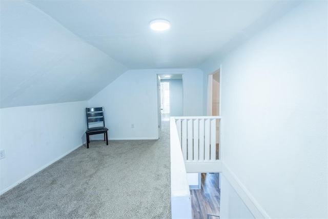 709 S Broadway, Geary, OK 73040 - additional living space featuring baseboards, lofted ceiling, and carpet floors