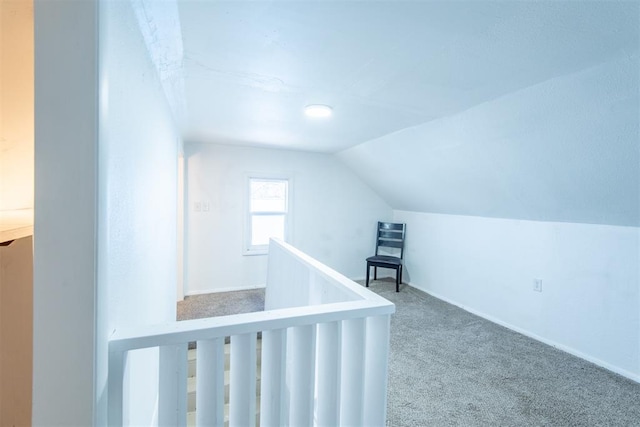 709 S Broadway, Geary, OK 73040 - additional living space with baseboards, carpet, and vaulted ceiling