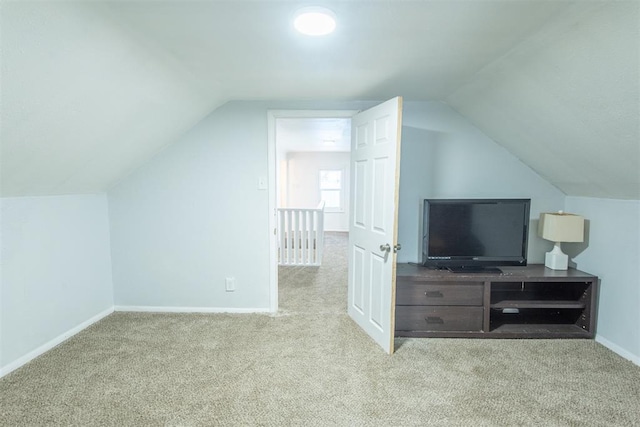 709 S Broadway, Geary, OK 73040 - bonus room featuring vaulted ceiling, baseboards, and carpet floors