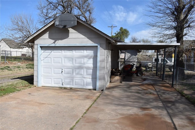 201 N Williams Ave, El Reno, OK 73036 - garage with a garage, concrete driveway, and fence