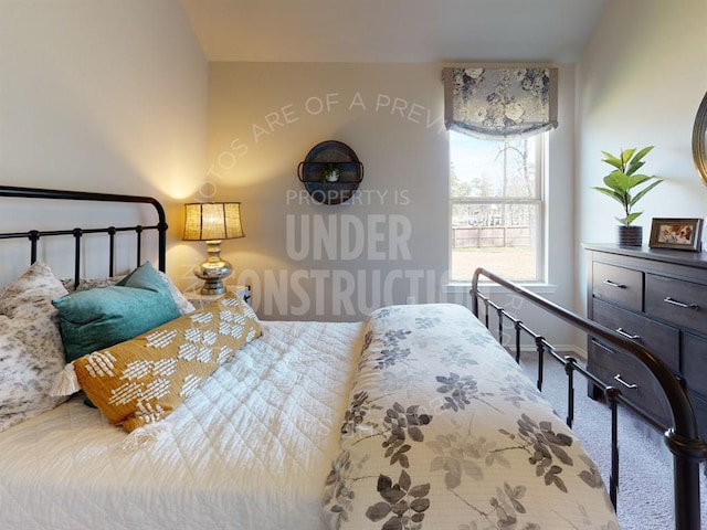 carpeted bedroom with vaulted ceiling