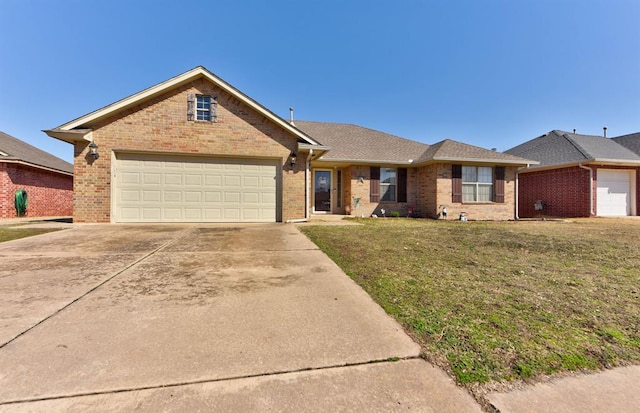 single story home featuring concrete driveway, brick siding, a front lawn, and an attached garage