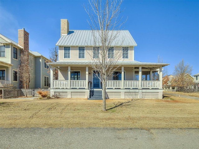 39 Boulevard, Carlton Landing, OK 74432 - view of front of house with covered porch, metal roof, a chimney, and a standing seam roof