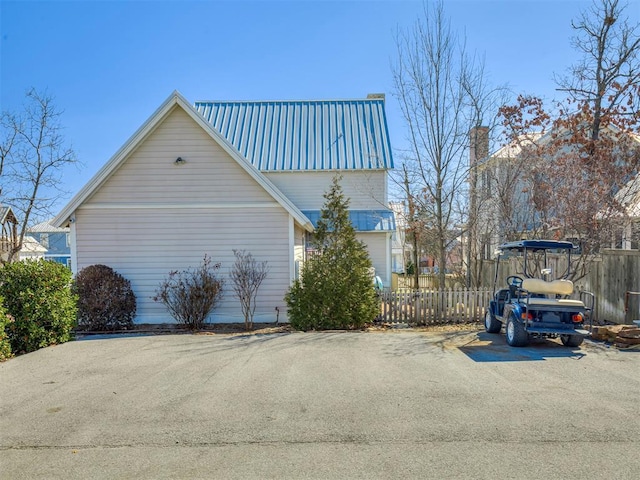 39 Boulevard, Carlton Landing, OK 74432 - view of home's exterior featuring metal roof and fence