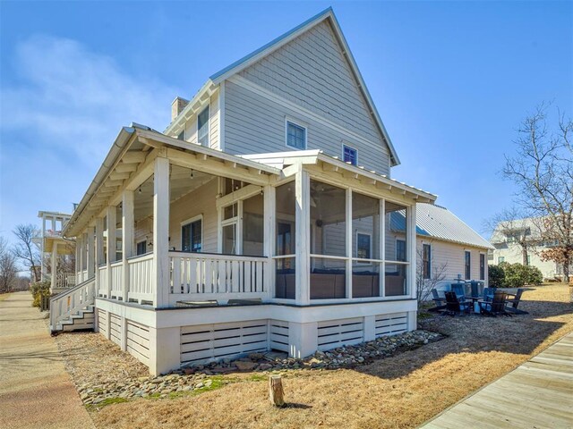 39 Boulevard, Carlton Landing, OK 74432 - view of side of home with a sunroom