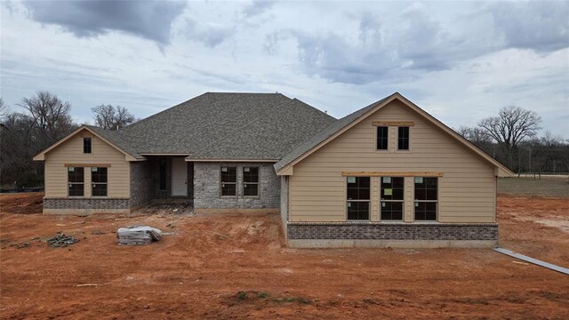 10200 Gentry Xing, Oklahoma City, OK 73169 - view of front facade with roof with shingles and brick siding