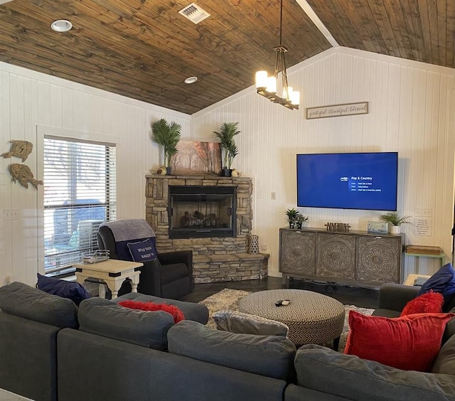 living room with visible vents, an inviting chandelier, a fireplace, wood ceiling, and vaulted ceiling