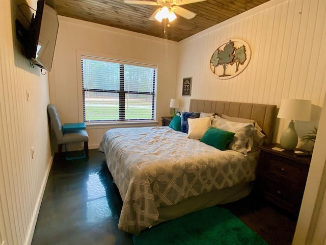 bedroom featuring wooden ceiling, finished concrete flooring, baseboards, and ceiling fan