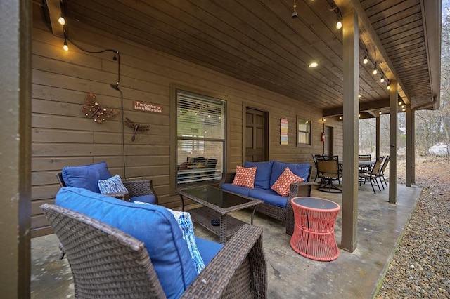 view of patio featuring outdoor dining space and an outdoor living space