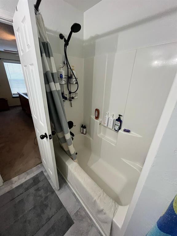 bathroom with shower / tub combo with curtain