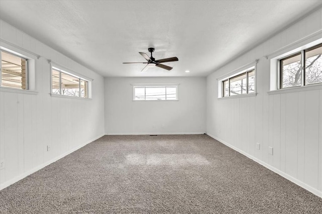 10313 N Mckinley Ave, Oklahoma City, OK 73114 - unfurnished room featuring a textured ceiling, ceiling fan, baseboards, and carpet