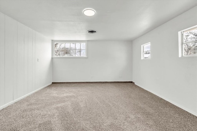 10313 N Mckinley Ave, Oklahoma City, OK 73114 - unfurnished room featuring visible vents, carpet, baseboards, and a wealth of natural light