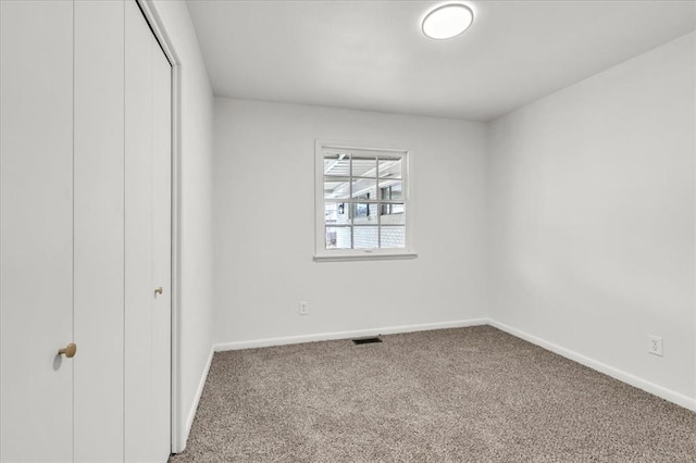10313 N Mckinley Ave, Oklahoma City, OK 73114 - unfurnished bedroom with carpet floors, baseboards, visible vents, and a closet