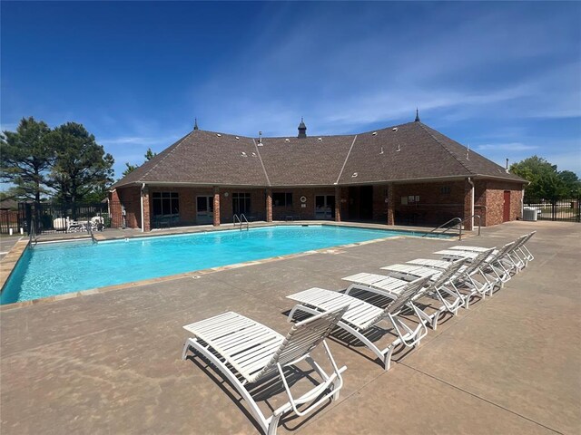 10931 Silo Ridge Rd, Oklahoma City, OK 73170 - community pool featuring a patio area and central AC