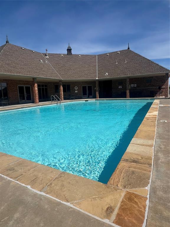 10931 Silo Ridge Rd, Oklahoma City, OK 73170 - community pool with french doors