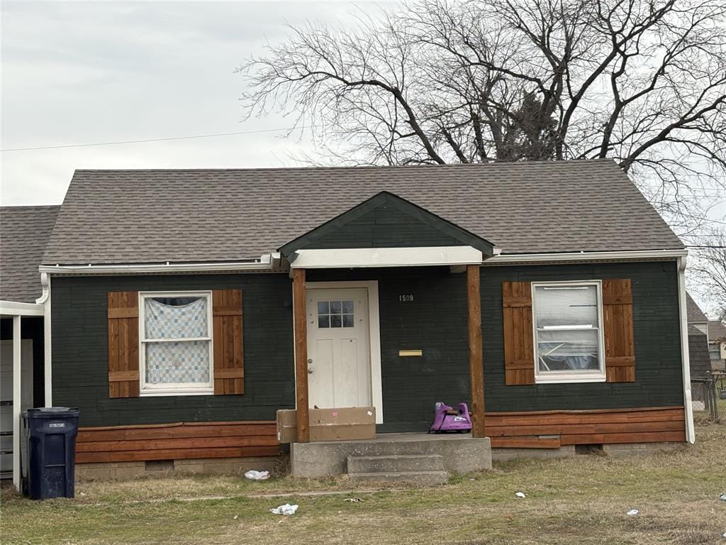 bungalow-style house with entry steps, crawl space, and roof with shingles