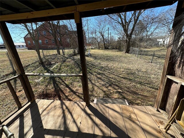 view of yard with fence and a wooden deck