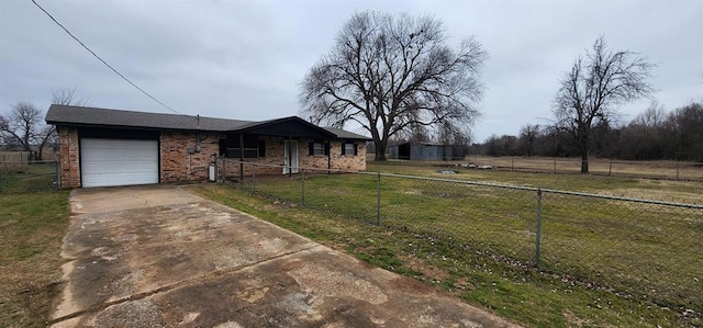 view of front of home with a fenced front yard, brick siding, concrete driveway, an attached garage, and a front lawn