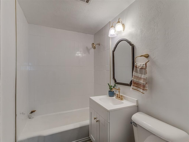 full bathroom featuring a textured wall, shower / bathing tub combination, toilet, vanity, and a textured ceiling