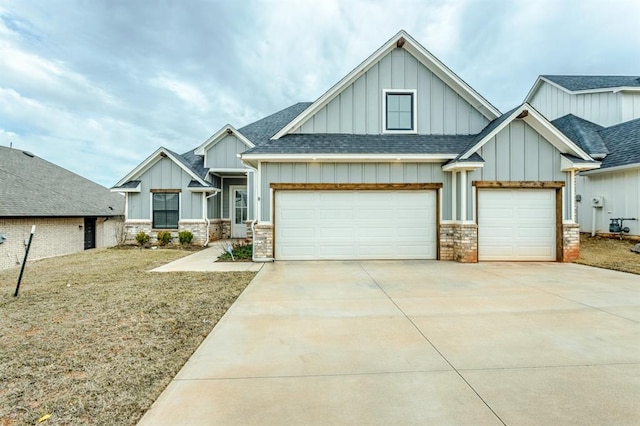 craftsman house featuring board and batten siding, a shingled roof, driveway, and a garage